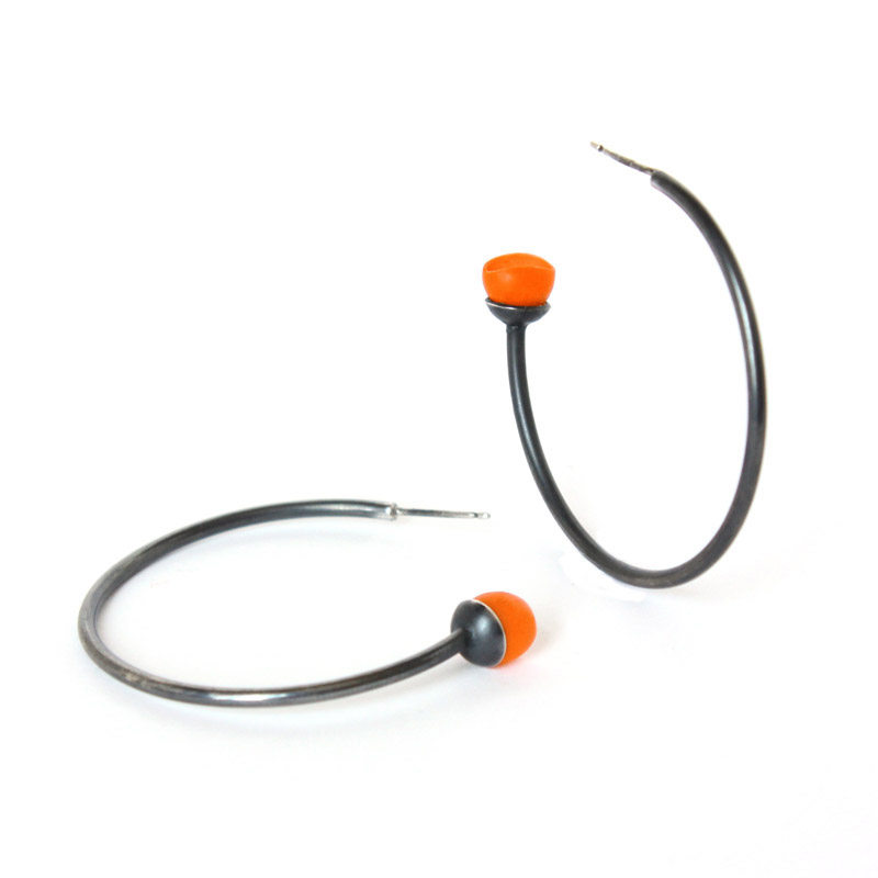 Orange oxidised hoops by Jenny llewellyn
