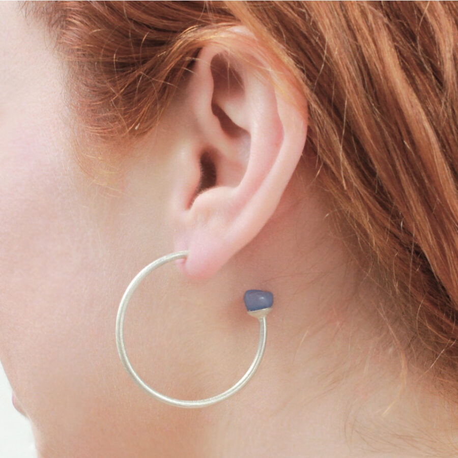 Large silver hoops worn by Jenny Llewellyn